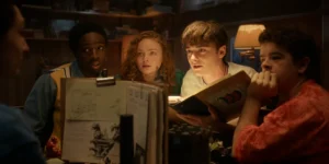 Finn Wolfhard as Mike Wheeler, Caleb McLaughlin as Lucas Sinclair, Sadie Sink as Max Mayfield, Noah Schnapp as Will Byers, and Gaten Matarazzo as Dustin Henderson play their last D&D game in the Stranger Things: Season 5 Finale