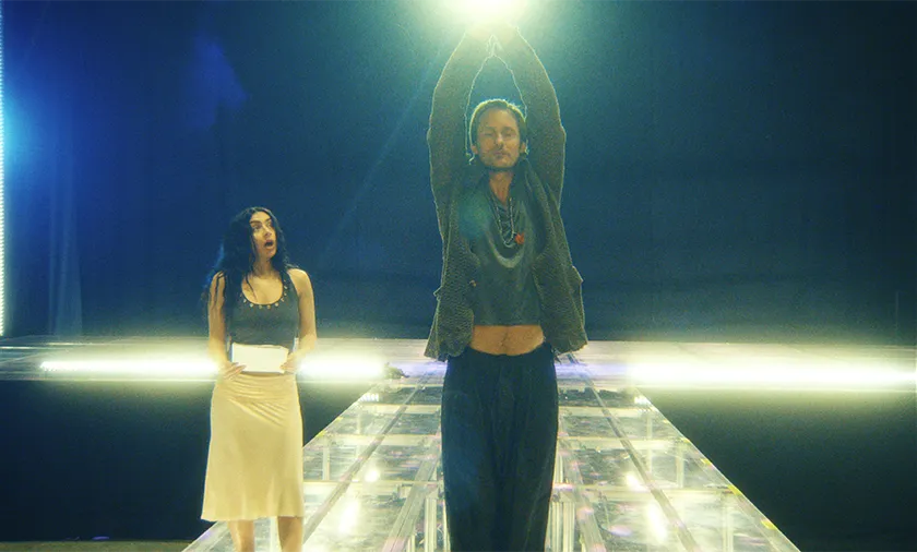 Charli XCX and Alexander Skarsgård in The Moment