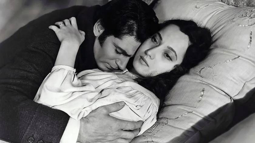 Merle Oberon and Laurence Olivier in Wuthering Heights (1939), one of all the Wuthering Heights movie adaptations ranked from worst to best by Loud and Clear Reviews