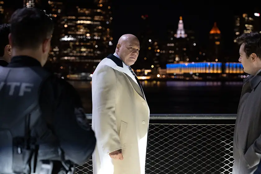 Wilson Fisk / Kingpin (Vincent D’Onofrio) looks at two people by the water in NY wearing a white coat in Daredevil: Born Again Season 2