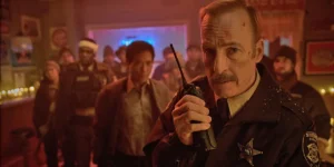 Bob Odenkirk with a crowd behind him in the 2026 movie "Normal"