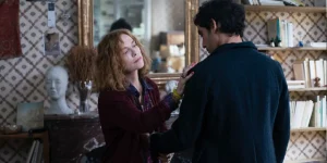 A woman touches a man's shoulder in a still from Parallel Tales (Histoires Parallèles)