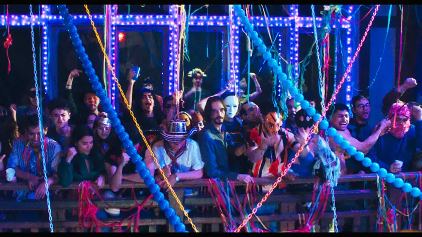 People party in a still from The Unknown (L'Inconnue)