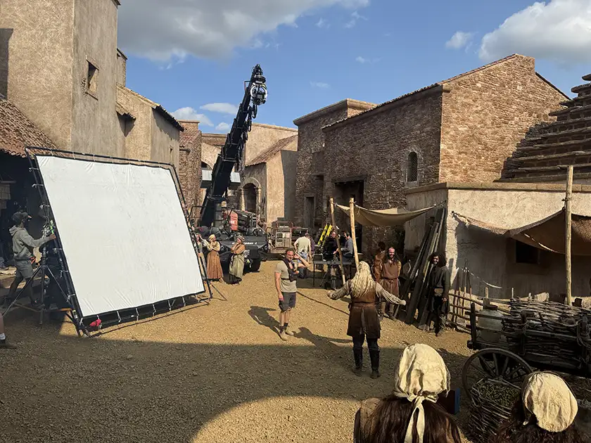 A still from the set of House of the Dragon Season 3, featuring the town and PJ Dillon, whom we interview, shooting it