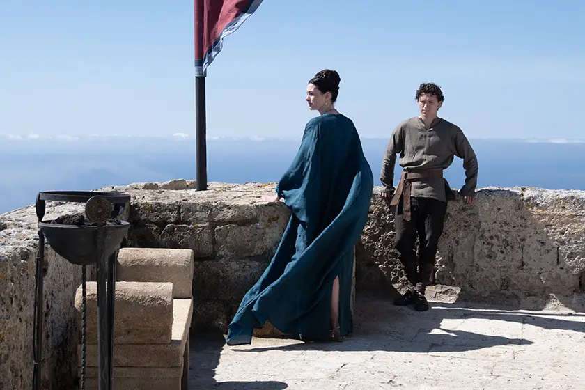 L to R: Anne Hathaway is Penelope and Tom Holland is Telemachus in "The Odyssey", written, produced, and directed by Christopher Nolan.