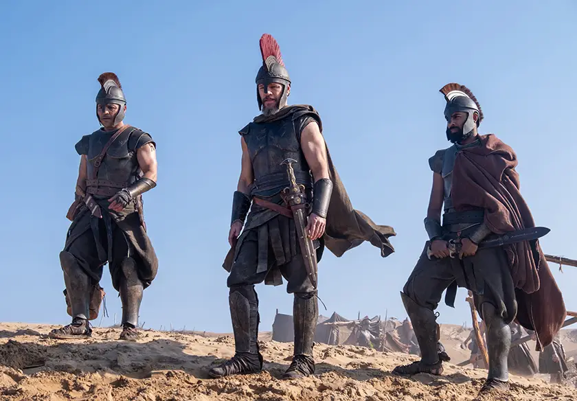L to R: Jimmy Gonzales is Cepheus, Matt Damon is Odysseus and Himesh Patel is Eurylochus "The Odyssey", written, produced, and directed by Christopher Nolan.