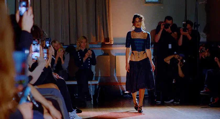 Mia Kudis walks down the runway in the film French Girls, from writer-director Hyun Lee whom we interview