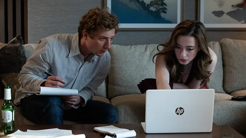 Jeff Horwitz (Jeremy Allen White) and Frances Haugen (Mikey Madison) look at an HP computer screen in The Social Reckoning